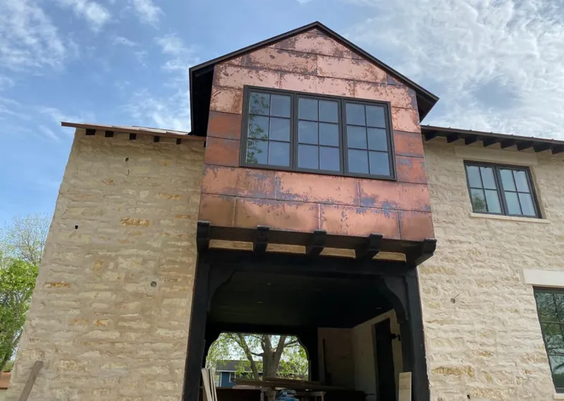 Copper metal panel facade on a stone building for Skylight Installation in Rancho Mirage
